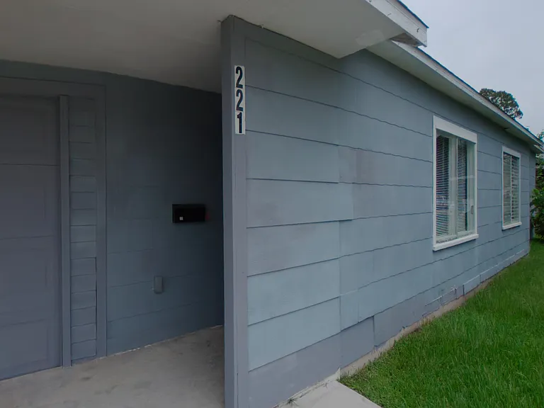 Front exterior view of this 3-bedroom, 2-bathroom Pasadena rental home, featuring a covered entry, attached garage, and a spacious backyard. Explore the included 360_ virtual tour for a complete look inside.