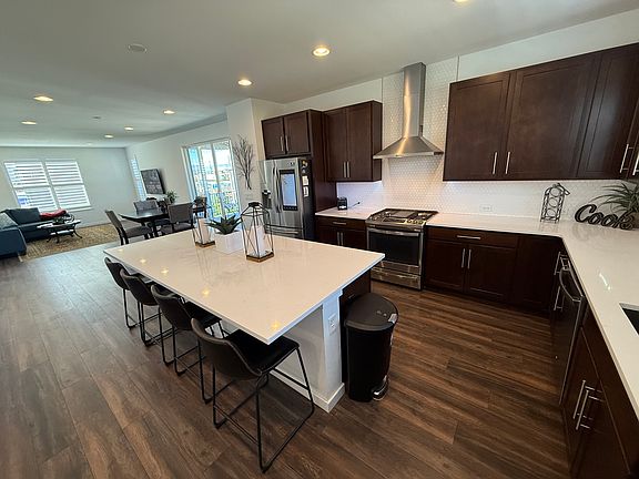 Spacious kitchen with modern appliances and smart fridge