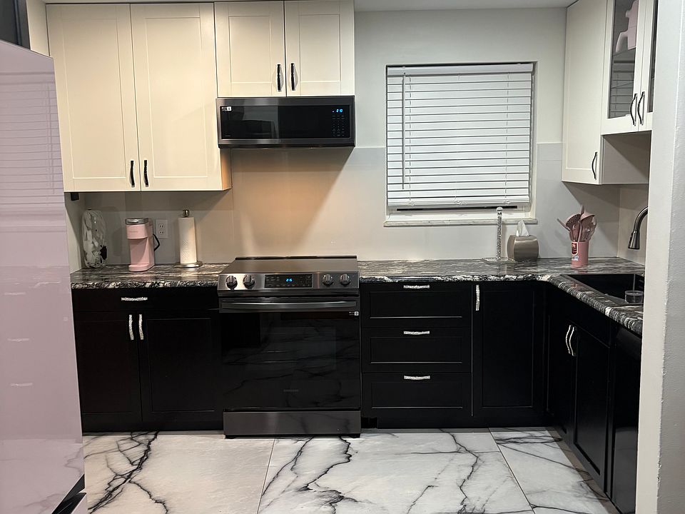 New microwave and oven and refrigerator.