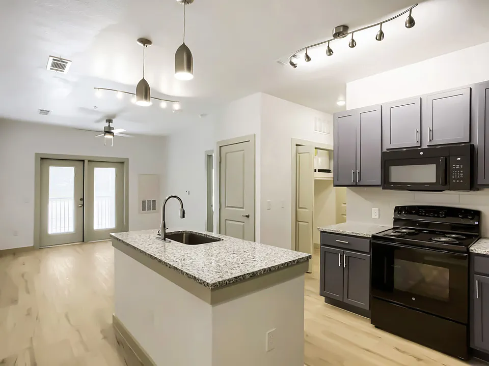 kitchen with island and view of living room