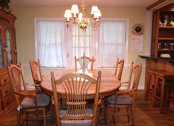 Formal dining room has door to rear porch