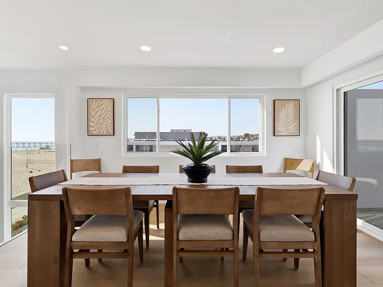 At the top of the third floor you will find a chef's kitchen with walk-in pantry, breakfast nook, 8-sit dining table, and rooftop patio with direct stair access to the street