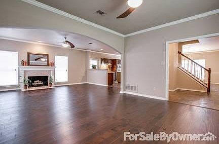 Huge Living Area w/ Hardwood Flooring : Great living area, custom stone fireplace, open view to kitc