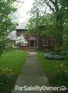 2543 Euclid Heights Boulevard : Sandstone, trees, & spring flowers lead to front door--great curb ap