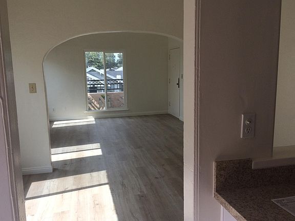 view from kitchen to dinner room and living room