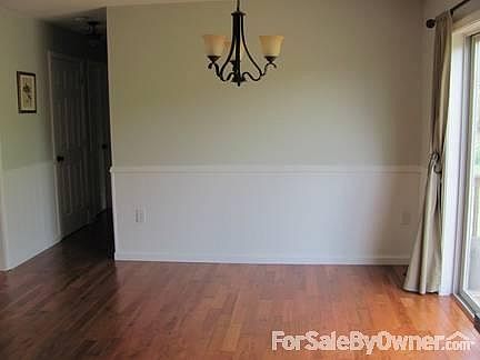 Dining Room
						:
						Modern dining room with wainscotting,