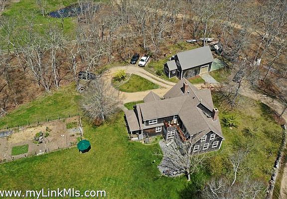 Aerial from west shows garden and overall layout.