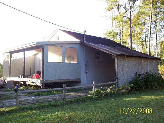 Work shop with large bay doors/carport