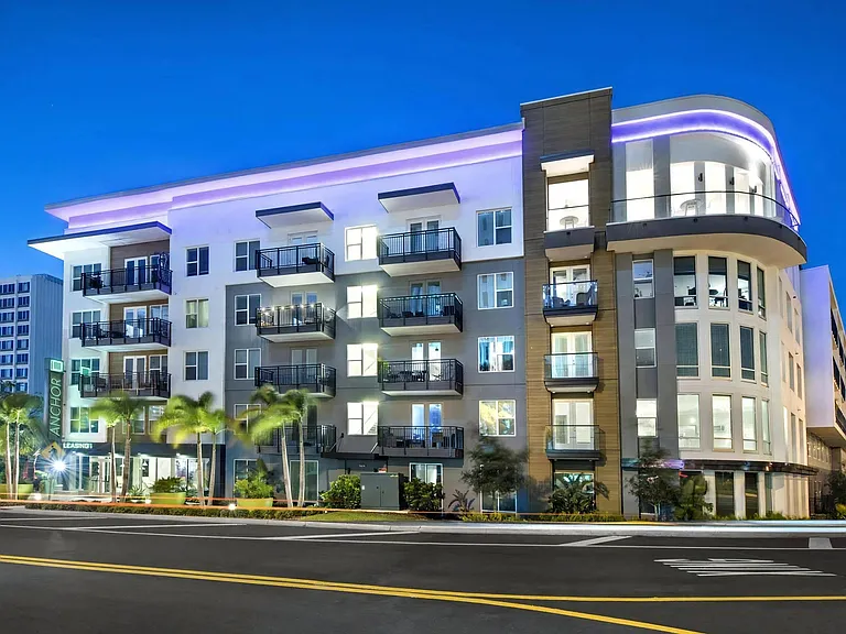 Anchor Riverwalk Apartment Exterior with Balconies and Modern Lighting