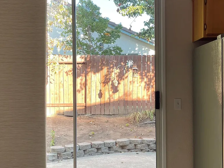 Sliding door leading to the backyard.