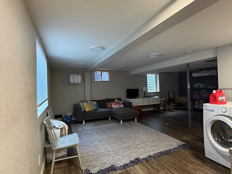 Lower level entertainment or office space with laundry and plenty of storage