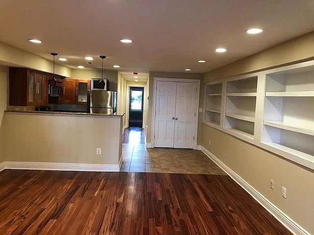 Living room and eat-in kitchen, as well as hallway that leads to the bedroom, bathroom and laundry closet.