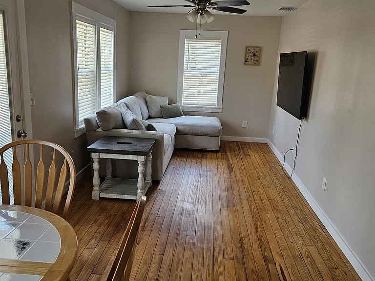 Living room with TV and expandable dining table
