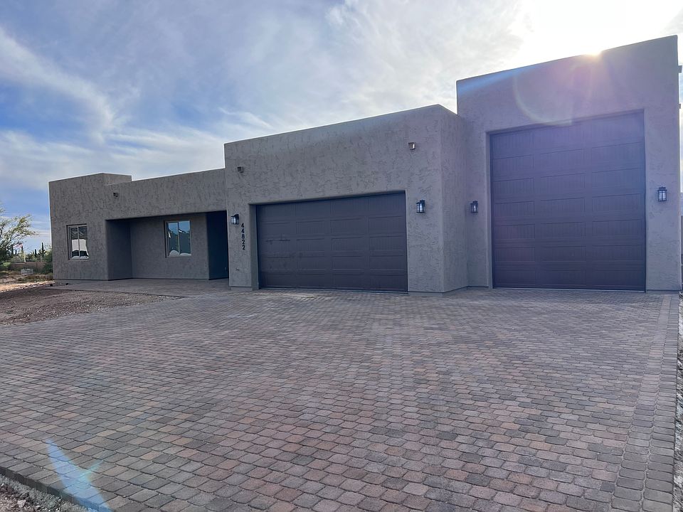 Front of home, paver driveway, attached RV garage.