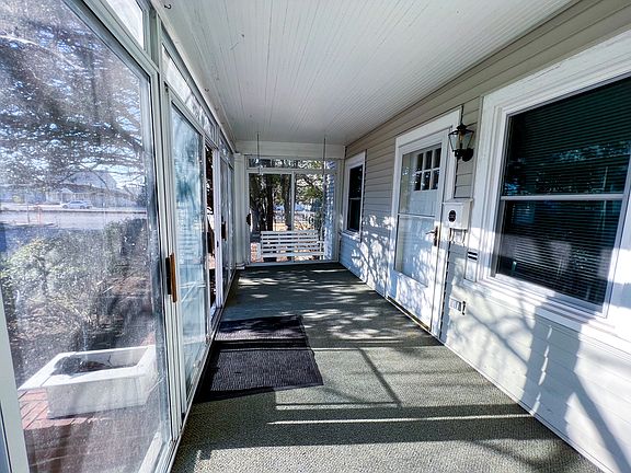 Carpeted & glass enclosed spacious porch