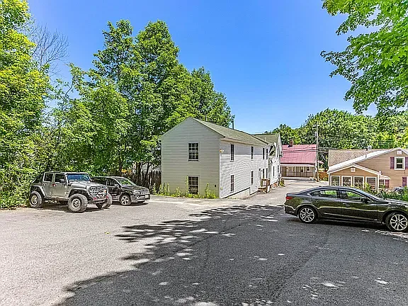 Rear building. Private off-street parking lot.