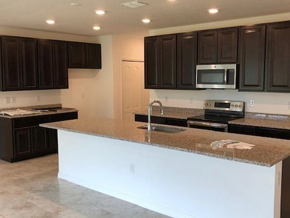 Huge kitchen island with granite countertops