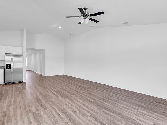 Get ready to host watch parties and game nights in this expansive living room