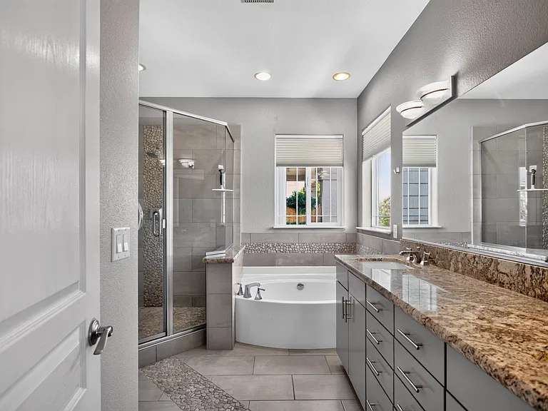 Masterbath with dual sinks in granite countertop. Jetted soaking tub, Walk-in shower