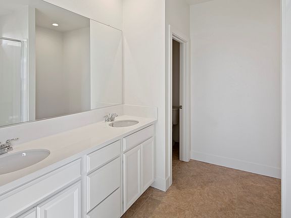 Owner s bath with ample cabinets