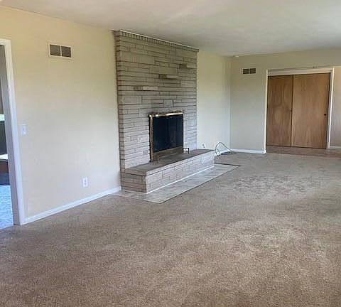 Living Room / Dining room with wood fireplace