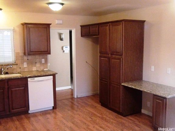 Another view of kitchen.  Window over sink looks out front entryway.