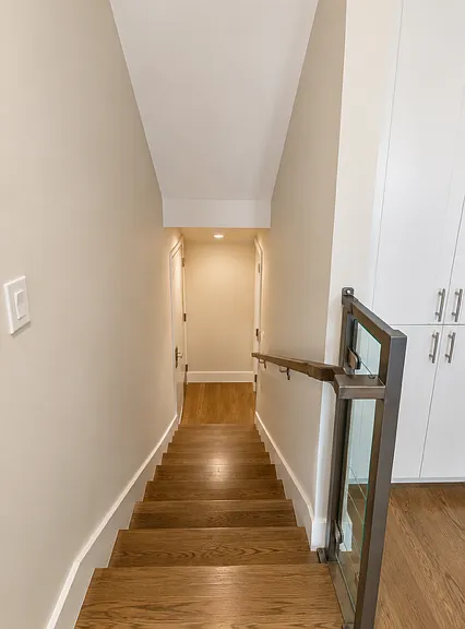 stairs from living room / kitchen level down to bedroom level