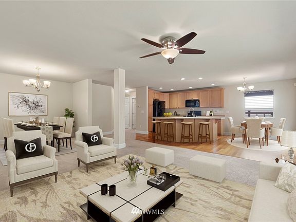 Large open concept living with views of kitchen, dining, eat-in kitchen, deck and beautiful backyard with expansive greenbelt. Virtually Staged 