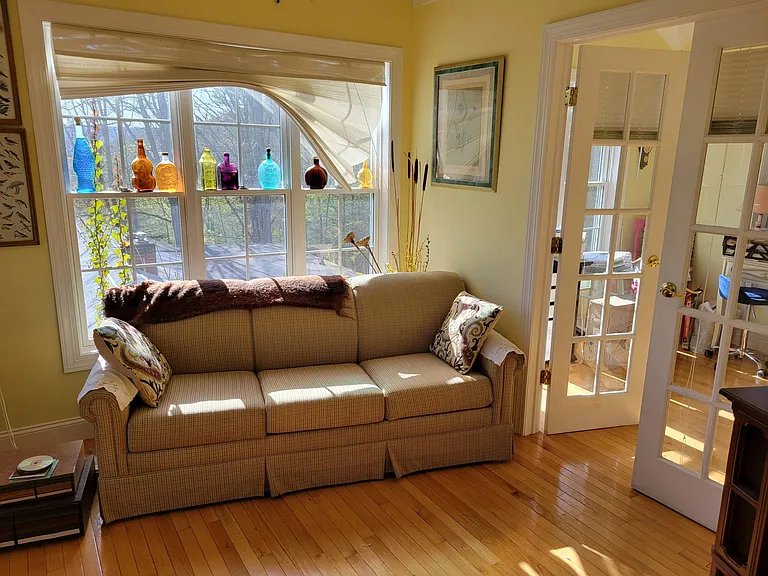 Blazing Sunroom addition. Also have Smart TV. (This is a sleeper sofa). French doors lead to office with 3rd bed.