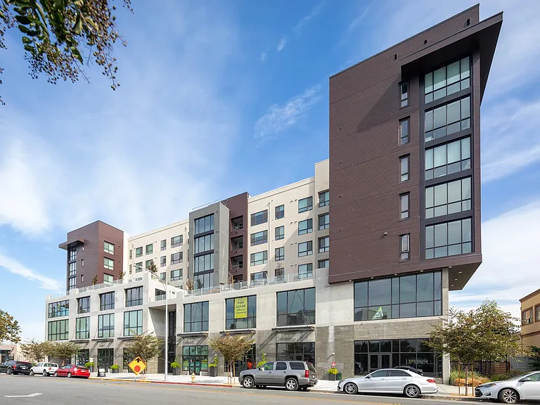 Street_side view highlighting the building's striking angles, expansive windows, and contemporary architectural design.