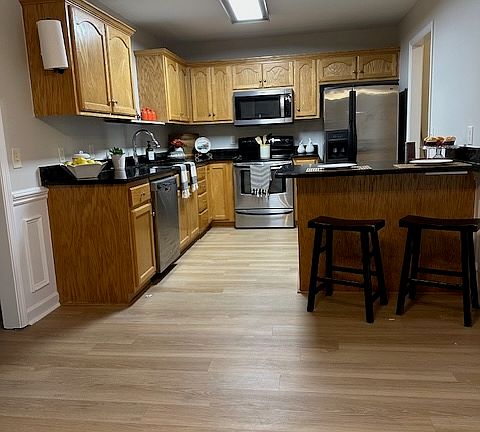Nice amount of cabinet space and working island for storage and seating. Double sink, stainless steel appliances. Drop zone/laundry-area/pantry as you come in the house from the garage.