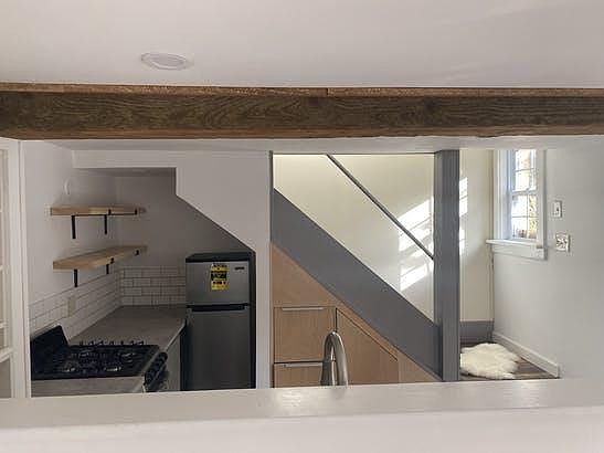 Kitchen/staircase to upper.