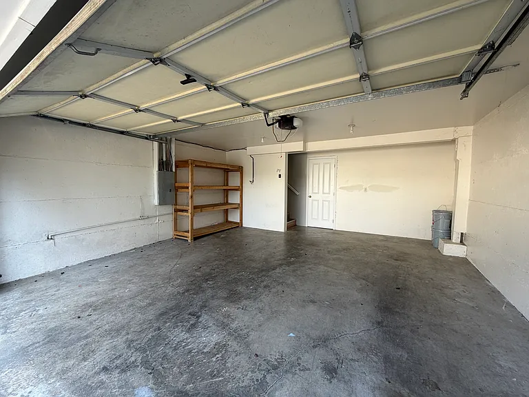 2 car garage with storage in the back