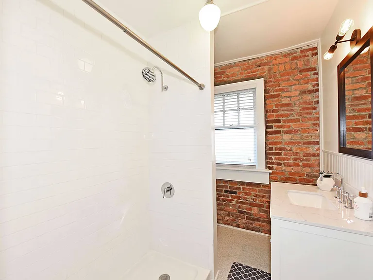 Exposed Brick and Tile Shower Surrounds