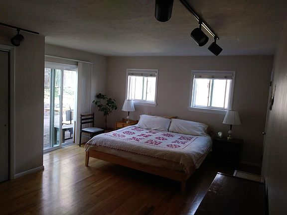 Master bedroom includes 2 closets and sliding door to deck