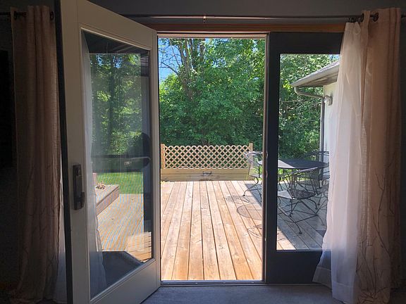 Living Room View to Deck, Waterfall and Koi Pond