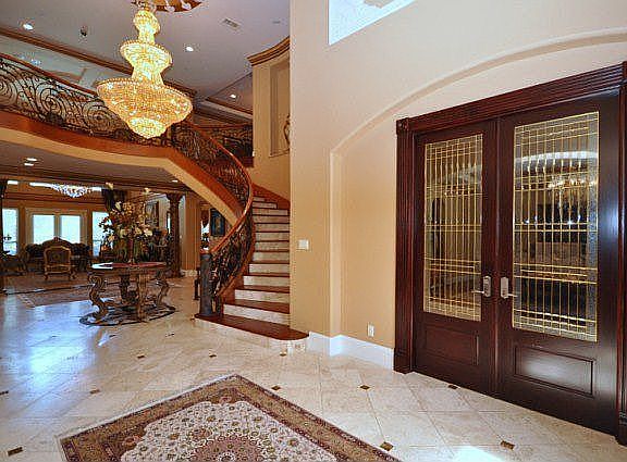 Elegant entryway. The study is behind the glass French door.
