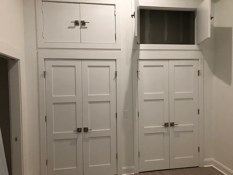 Bedroom closets with upper storage areas