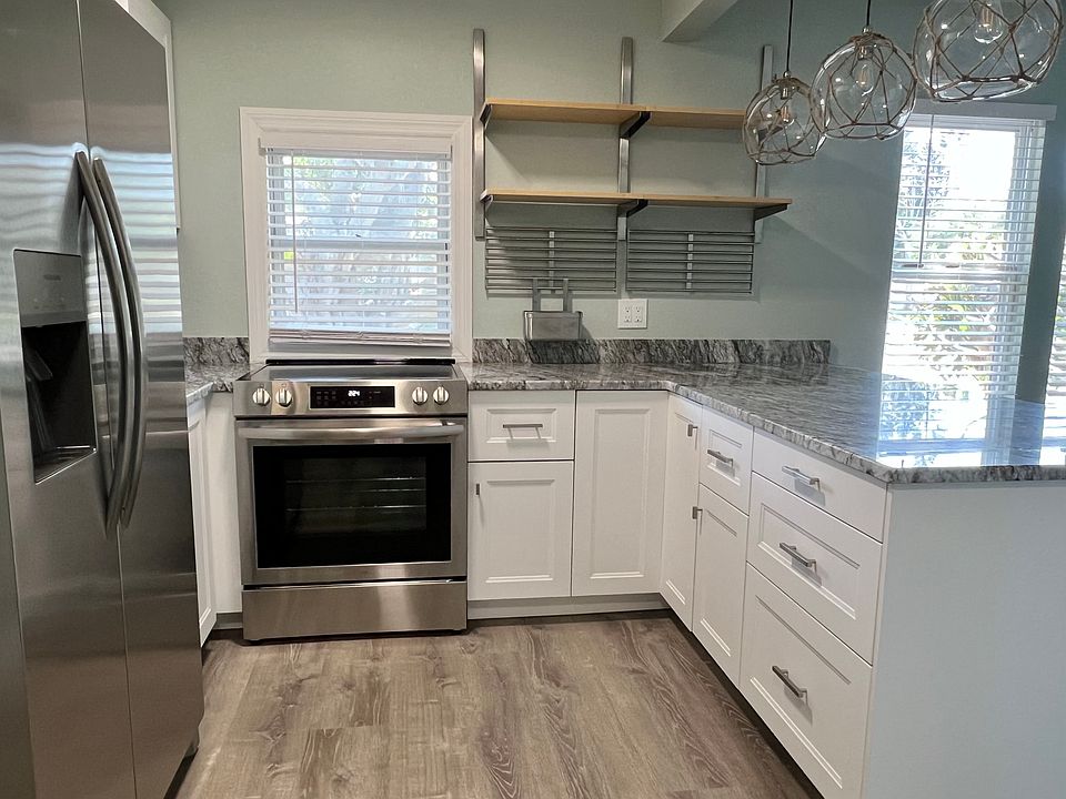 Sleek Stainless Steel Appliances
A full suite of stainless steel appliances offers a polished look and modern convenience, making meal prep effortless and cleanup a breeze.
