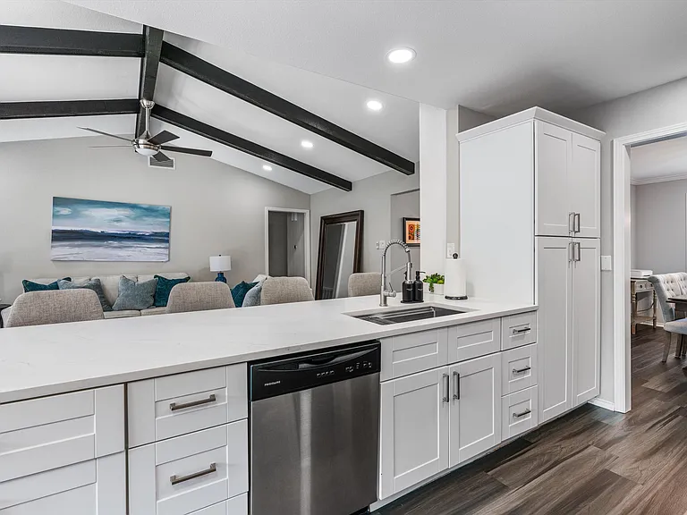 Open Concept Kitchen with all brand new appliances and Island Seating for 4 and breakfast table and extra storage in breakfast area.