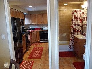Kitchen on left, full bathroom on right