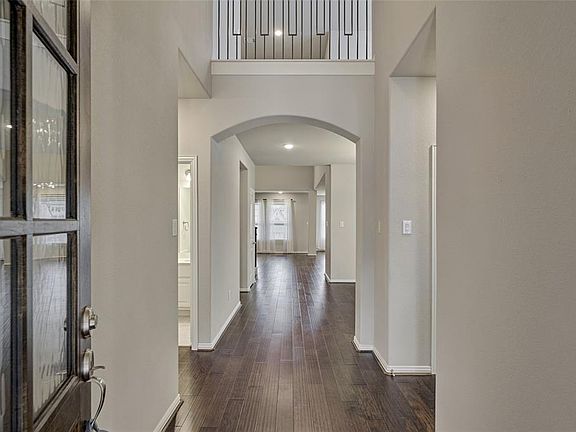 The beautiful entryway! Upon entering you will find gorgeous hardwood floors, high ceilings with fresh and neutral decor!
