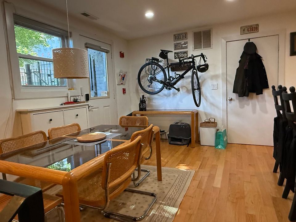 The dining room, open to the kitchen, is also adjacent to the interior storage/pantry