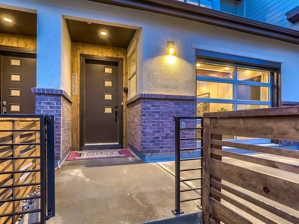 Gated, large patio with modern glass roll-up door in to living room!