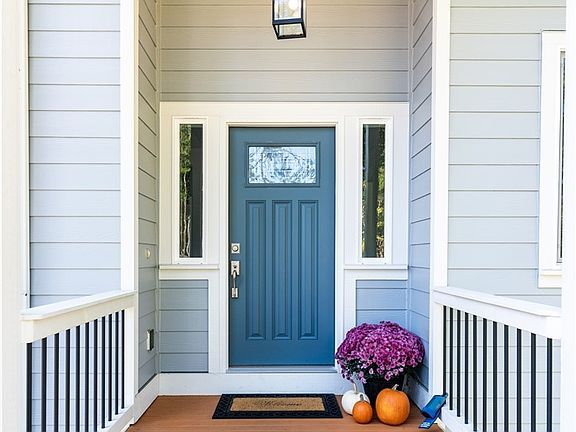 The covered front porch welcomes you to this incredible home.