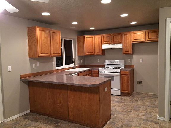 Kitchen view. Brand new refrigerator