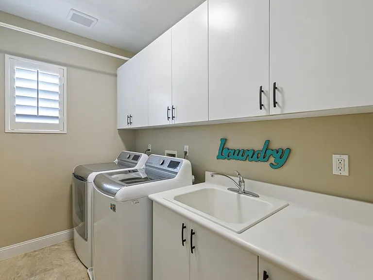 last room upstairs, large laundry room, now we head back downstairs to view bedroom 4 and the backyard