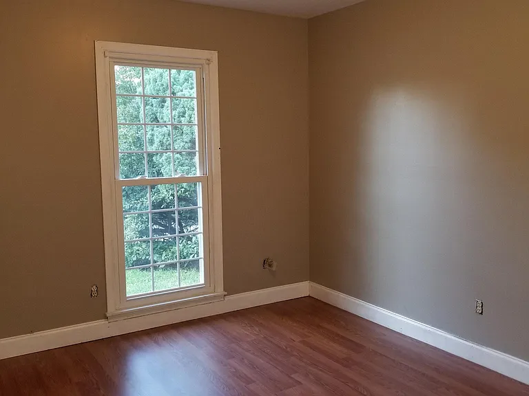 Bedroom 2 before new flooring and paint