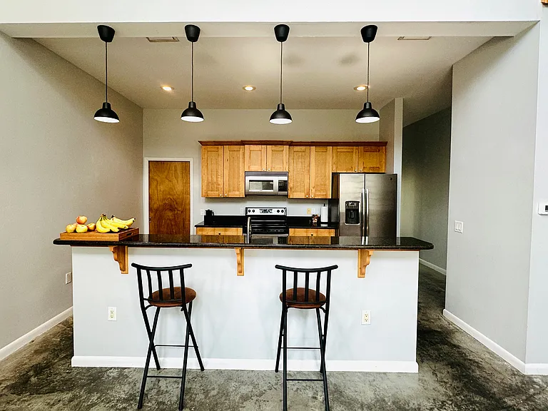 Kitchen with Stove, Fridge, Microwave, Dishwasher, European Wood Cabinets. Off of the kitchen to left is a full pantry closet with BRAND NEW LG Top Rated front loading washer and dryer. Comes with downstairs blinds.
