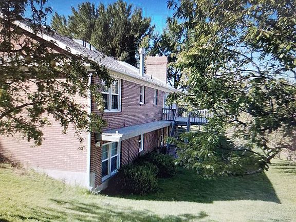 Back of home with orchard